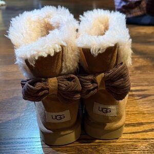UGG women’s Cozy Tan and Brown Boots with Bow